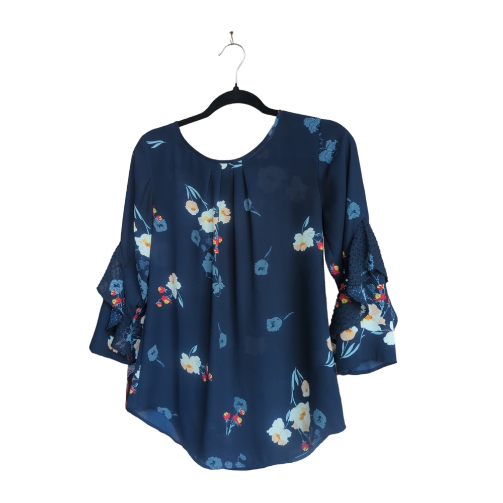 Floral blue with white and red. Size is extra small but easily fits small.